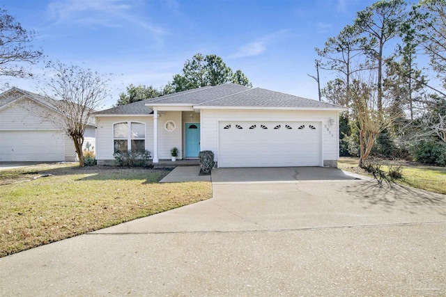 ranch-style home with a garage and a front lawn