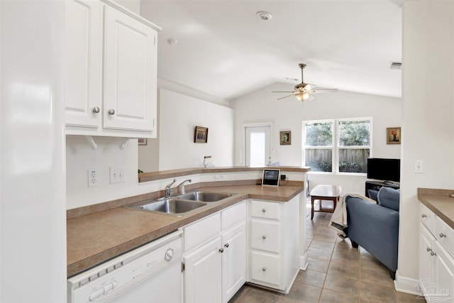 kitchen with white cabinetry, dishwasher, lofted ceiling, sink, and kitchen peninsula