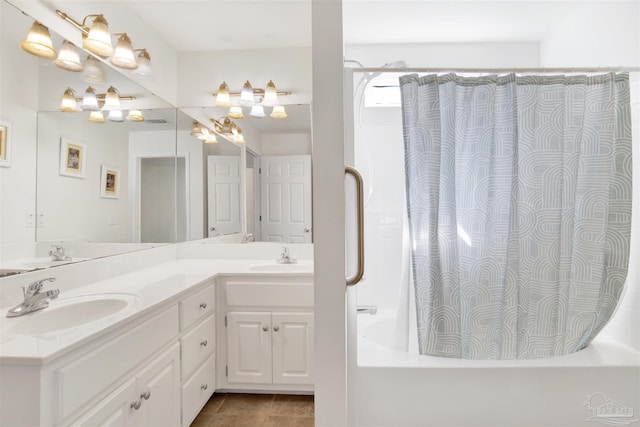 bathroom featuring shower / bath combination with curtain, tile patterned floors, and vanity