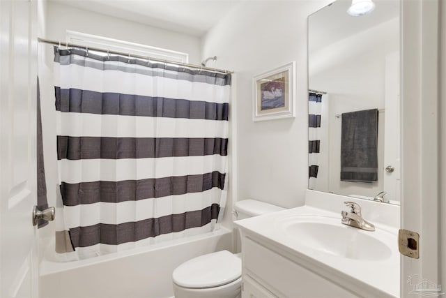 full bathroom featuring vanity, shower / bath combination with curtain, and toilet