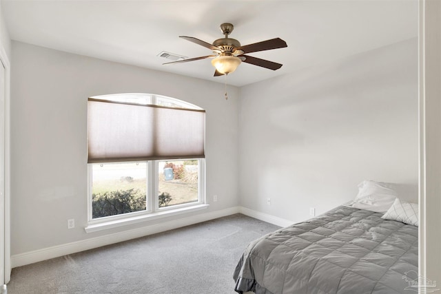 carpeted bedroom with ceiling fan