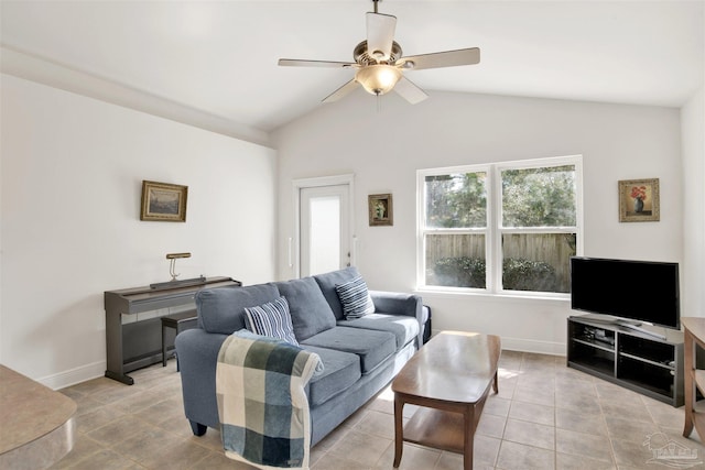 tiled living room with ceiling fan and vaulted ceiling