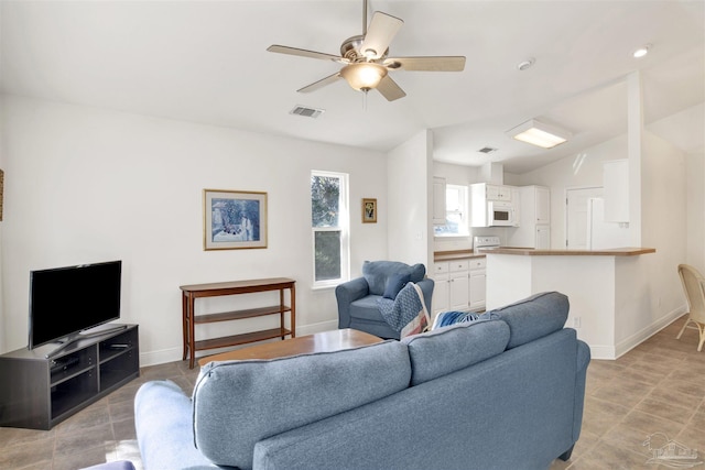 living room with lofted ceiling and ceiling fan