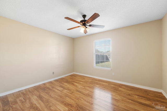 unfurnished room featuring ceiling fan, a textured ceiling, and light hardwood / wood-style flooring