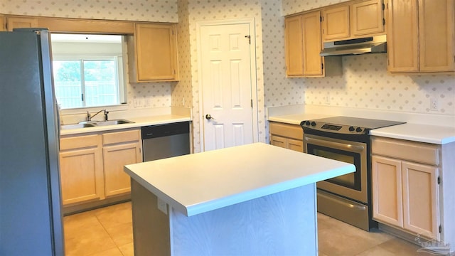 kitchen with sink, light brown cabinets, light tile patterned floors, appliances with stainless steel finishes, and a kitchen island