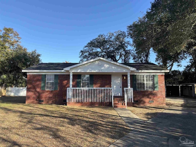 view of front facade with covered porch and a front lawn