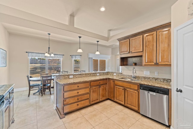 kitchen with sink, hanging light fixtures, stainless steel dishwasher, light tile patterned floors, and kitchen peninsula