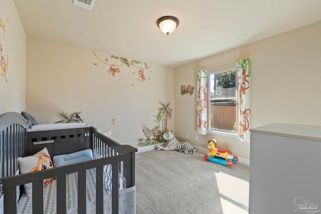 carpeted bedroom with a crib