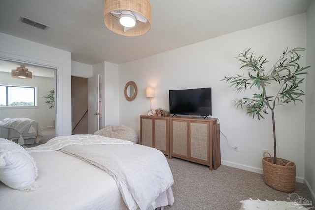 carpeted bedroom featuring ceiling fan