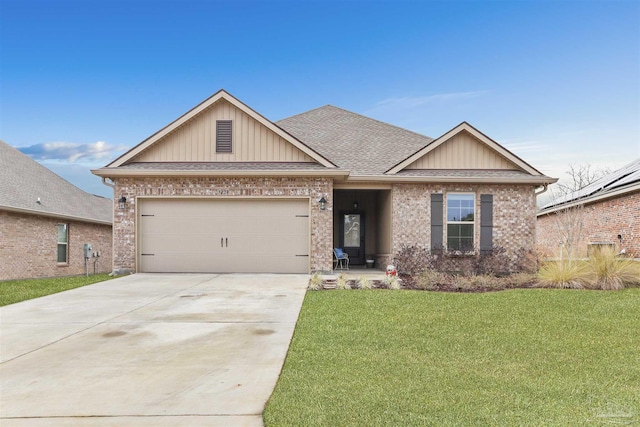 view of front of property featuring a garage and a front lawn