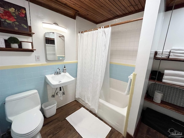 bathroom featuring tile walls, shower / bath combination with curtain, toilet, wood finished floors, and wooden ceiling