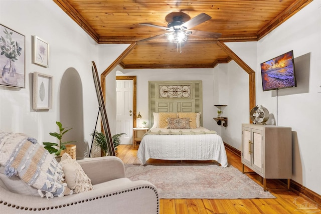 bedroom featuring light wood-type flooring, ornamental molding, and wooden ceiling