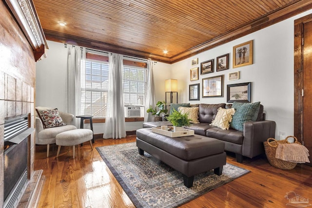 living area featuring wooden ceiling, cooling unit, ornamental molding, and wood finished floors