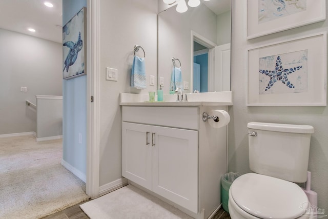 14273 Beach Heather Ct, Pensacola, FL 32507 - bathroom featuring recessed lighting, baseboards, toilet, and vanity