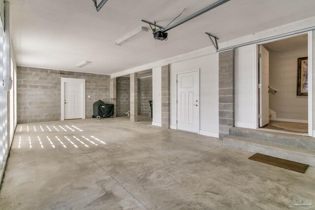 14273 Beach Heather Ct, Pensacola, FL 32507 - garage with concrete block wall and a garage door opener