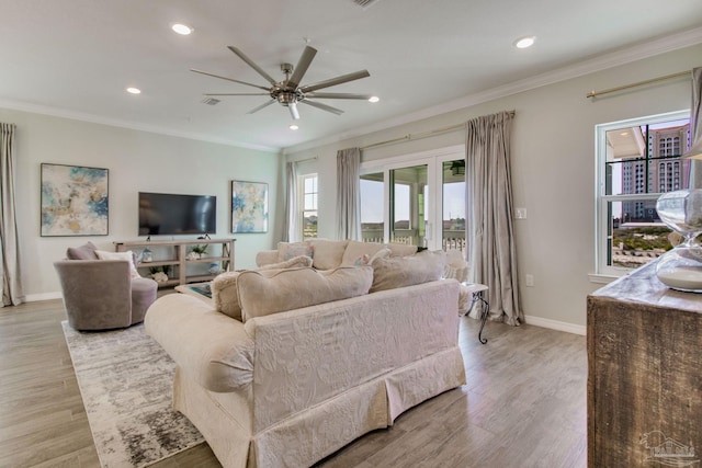 14273 Beach Heather Ct, Pensacola, FL 32507 - living room featuring ornamental molding, a ceiling fan, and light wood finished floors