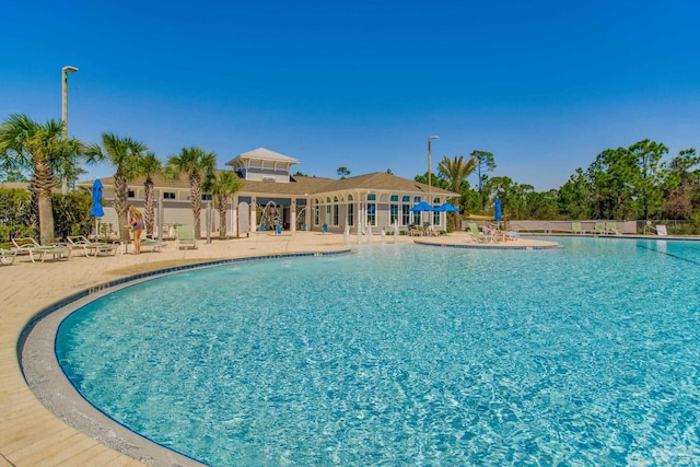 14273 Beach Heather Ct, Pensacola, FL 32507 - community pool featuring a patio and fence