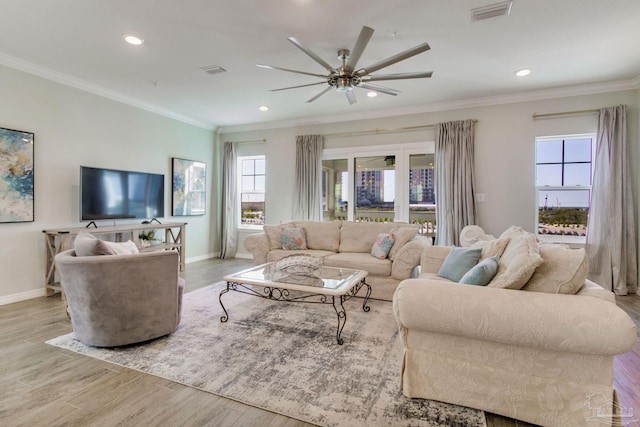 14273 Beach Heather Ct, Pensacola, FL 32507 - living area with crown molding, wood finished floors, visible vents, and ceiling fan