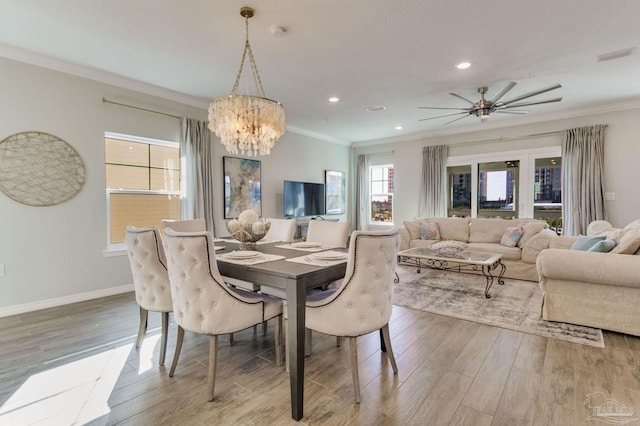 14273 Beach Heather Ct, Pensacola, FL 32507 - dining area featuring crown molding, wood finished floors, visible vents, and baseboards