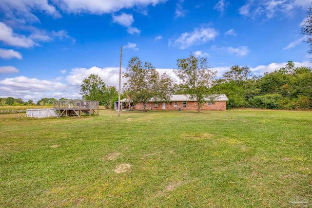 view of yard featuring a wooden deck