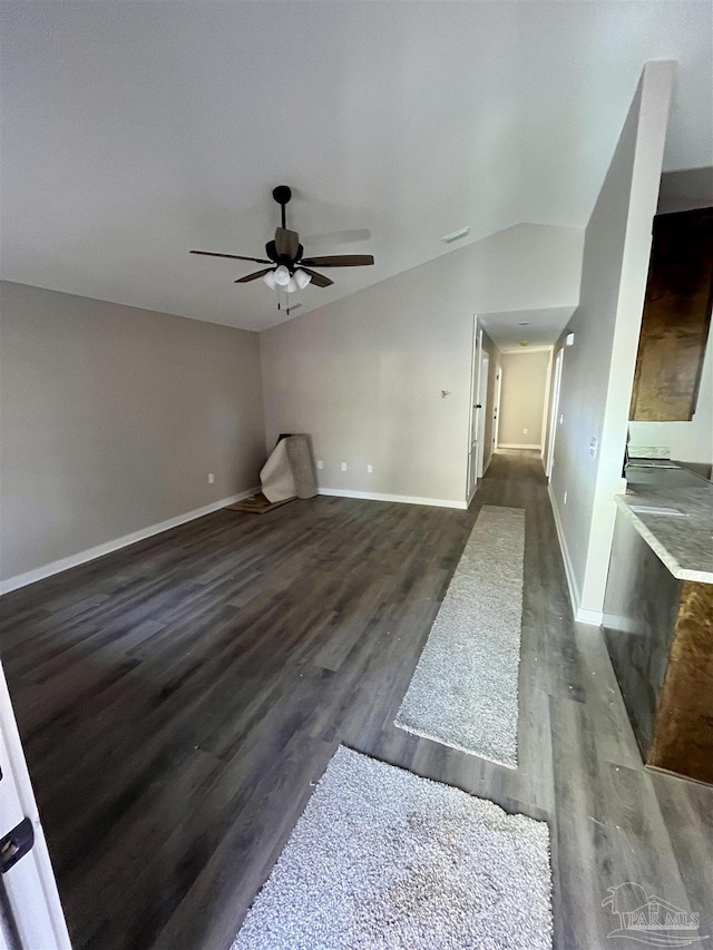 living room with dark hardwood / wood-style floors, ceiling fan, and lofted ceiling