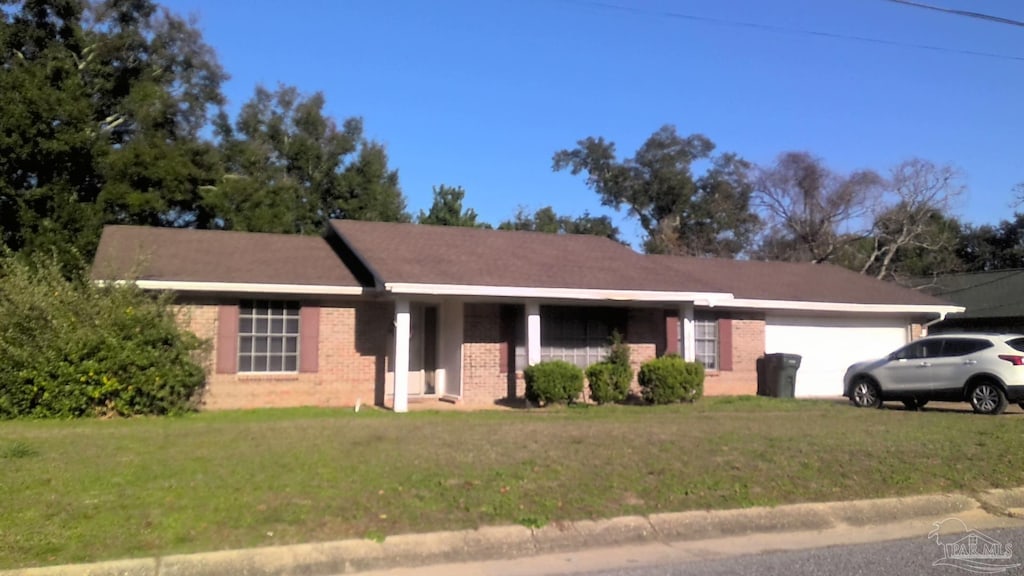 8194 Squire Rd, Pensacola, FL 32514 - single story home featuring an attached garage, a front yard, and brick siding