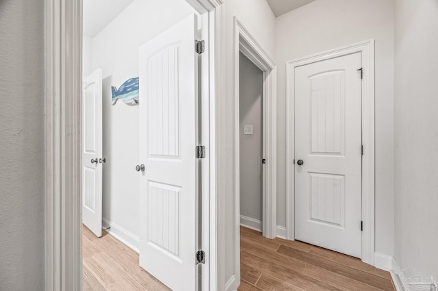 3066 Mountain Laurel Trl, Cantonment, FL 32533 - hallway with light wood finished floors and baseboards