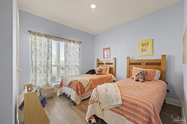 bedroom with wood-type flooring