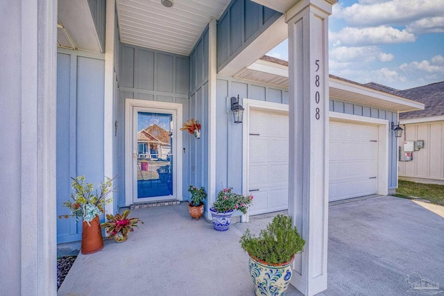 doorway to property with a garage