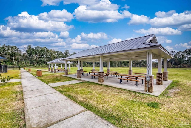 surrounding community featuring a gazebo and a lawn