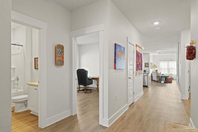 hall with light hardwood / wood-style floors