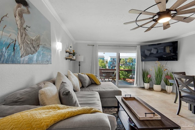 living room featuring ceiling fan, ornamental molding, and light tile patterned flooring