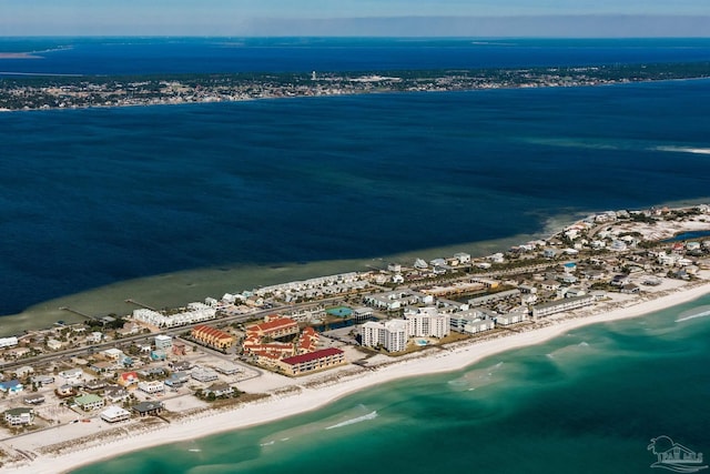 drone / aerial view featuring a water view and a view of the beach