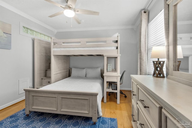 bedroom with ceiling fan, light wood-type flooring, multiple windows, and ornamental molding