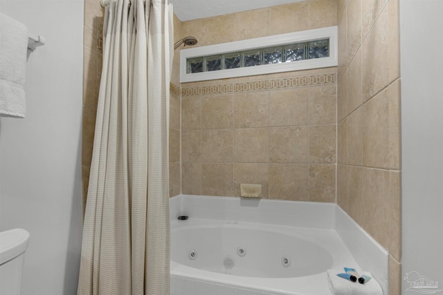 bathroom featuring toilet and shower / tub combo