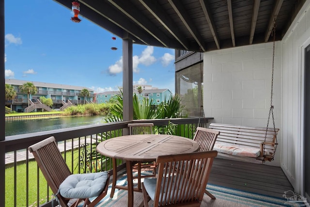 balcony featuring a water view