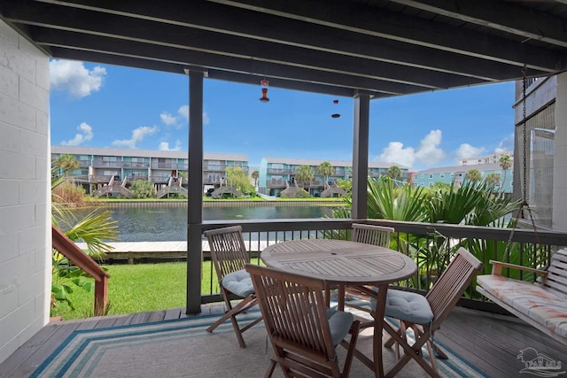 sunroom with a water view