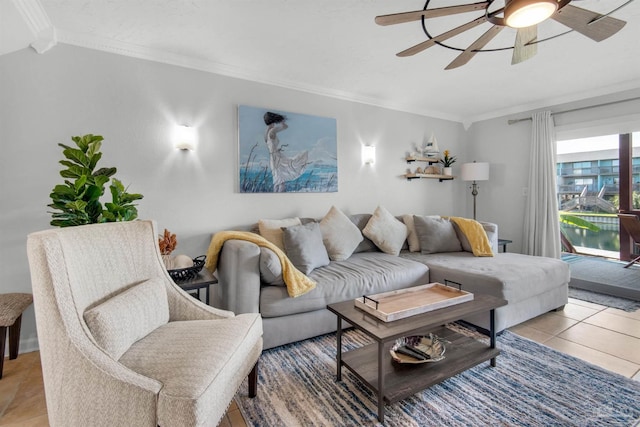 tiled living room with ceiling fan and ornamental molding