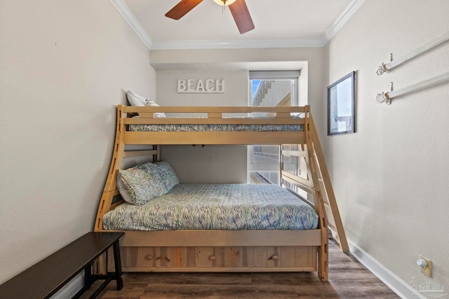 bedroom featuring ceiling fan, wood finished floors, baseboards, and ornamental molding