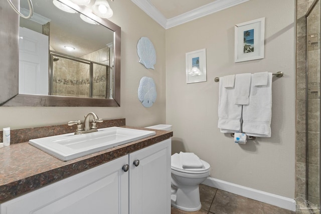 bathroom featuring baseboards, a stall shower, ornamental molding, tile patterned flooring, and toilet