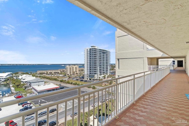 balcony with a view of city and a water view