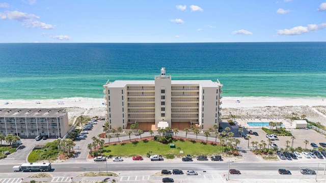 drone / aerial view featuring a view of the beach and a water view