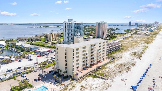 birds eye view of property with a city view and a water view