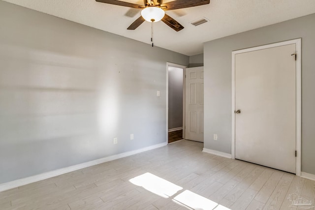 unfurnished bedroom featuring ceiling fan and light hardwood / wood-style flooring