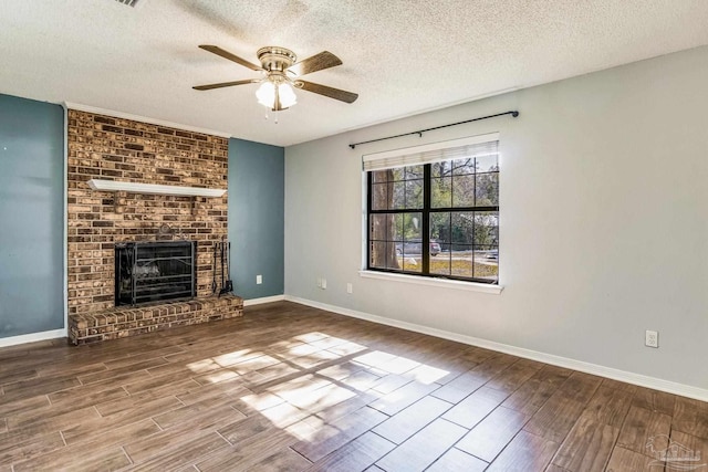 unfurnished living room featuring ceiling fan, a fireplace, and a textured ceiling