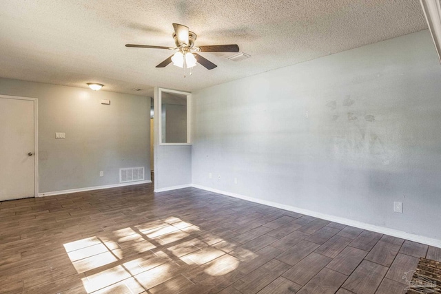 empty room featuring ceiling fan and a textured ceiling