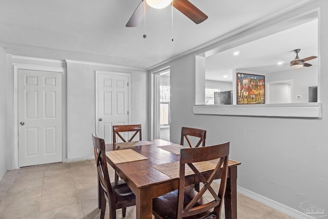 tiled dining space featuring ceiling fan