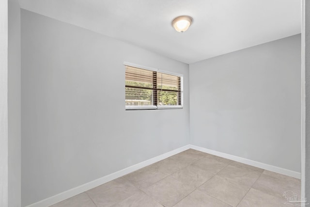 empty room with light tile patterned floors