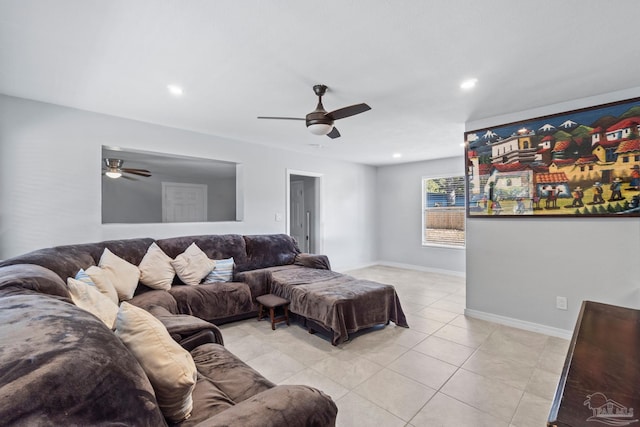 living room with light tile patterned floors and ceiling fan