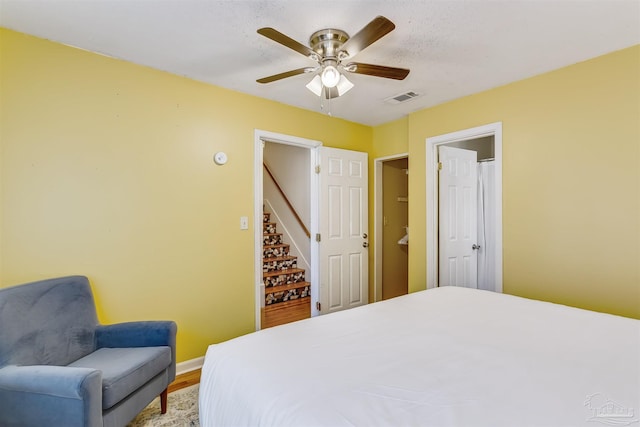 bedroom featuring hardwood / wood-style floors and ceiling fan